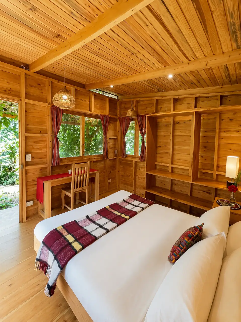 Garden Cabin: queen bed, desk and windows.