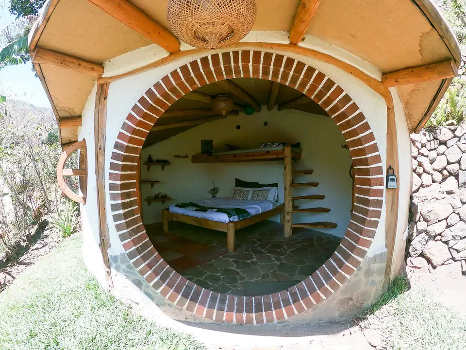 Hobbit House: round door with a view of the bed inside