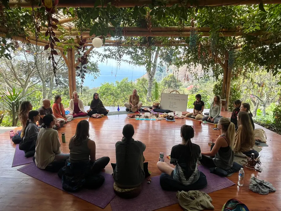 A retreat group in circle on the shala at Casa Kula
