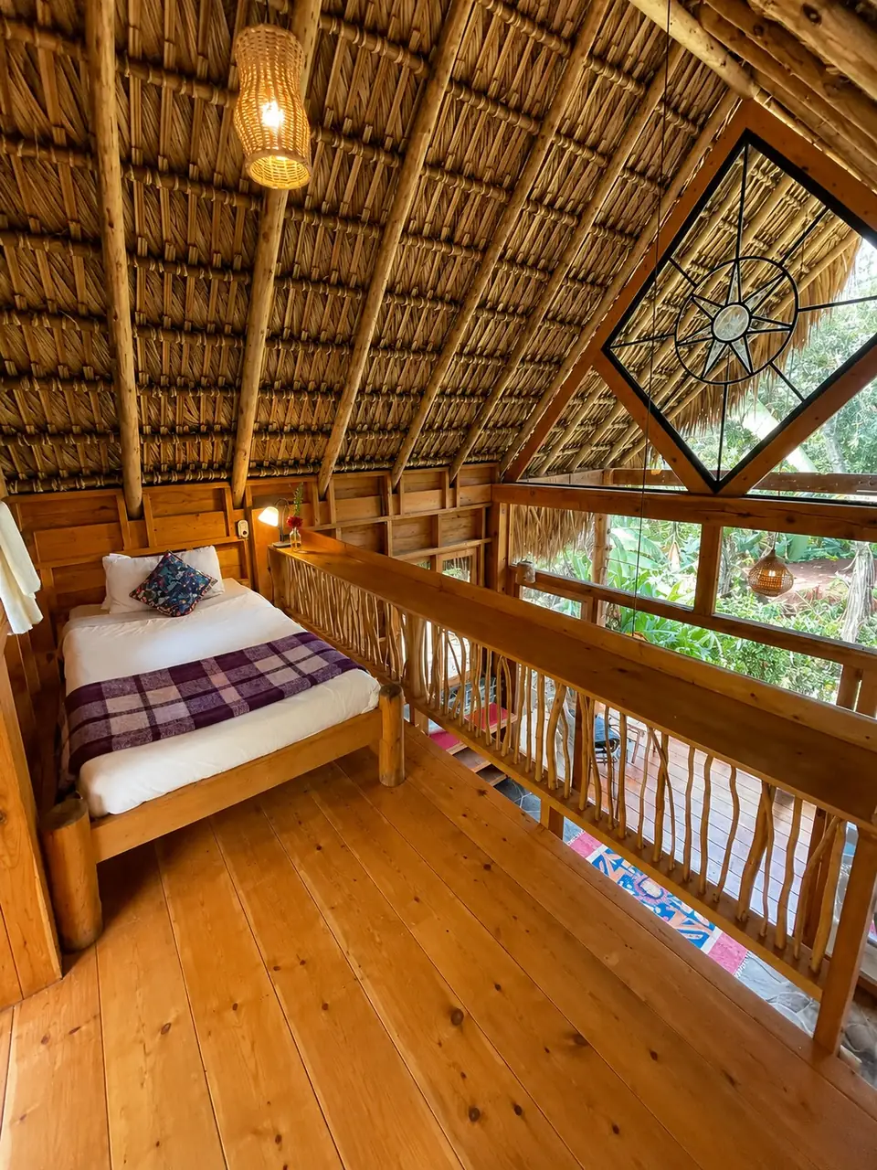 Inti: loft bed under the thatch with star-shaped window.