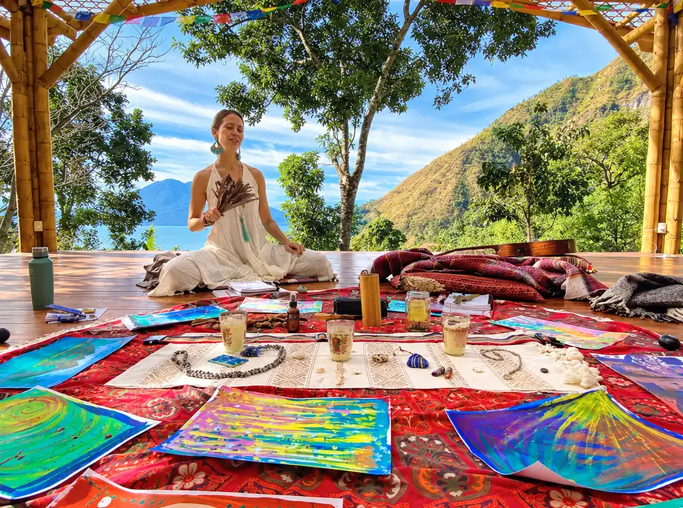 A guest meditating on the shala above the lake