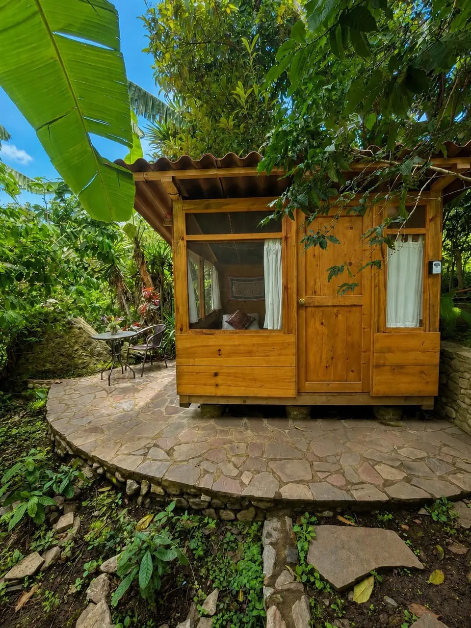 Tambo: exterior on a round stone patio.